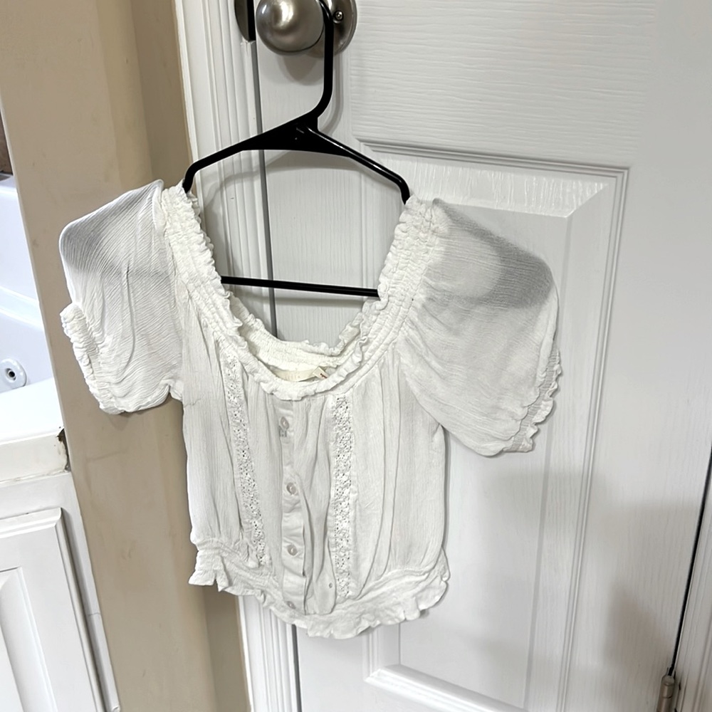 Slightly off white crop top. Size small.